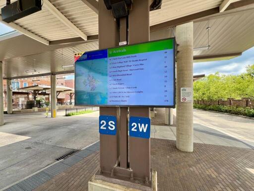 An outdoor bus tracking monitor at the Bloomington Transit Station