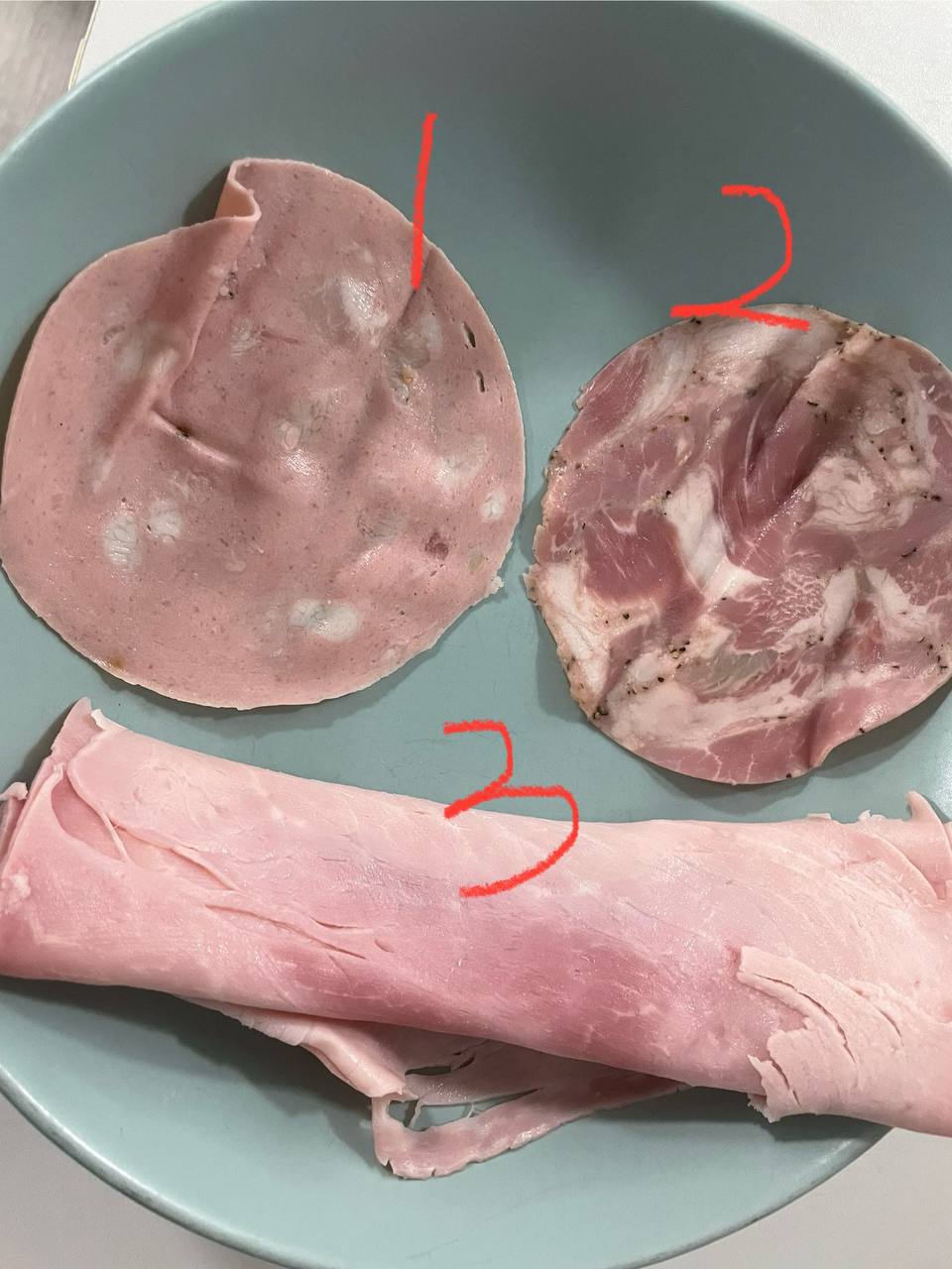 A photo of three types of Sliced Assorted Meat