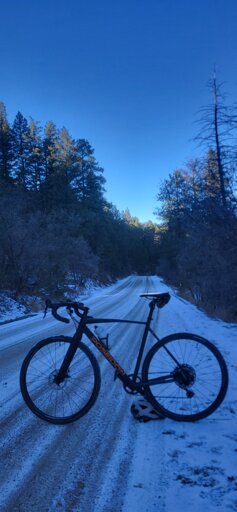 Gravel bike on a snowy dirt road