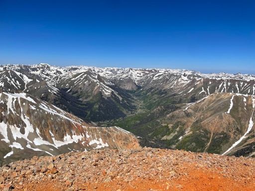 From the Redcloud summit, lots of little snowy peaks in the distance 