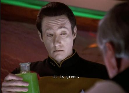 Data offers Scotty a bottle. "It is geen.'