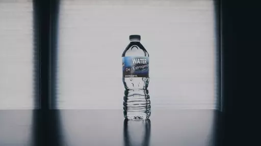 A water bottle labelled with "De-Estrogenized Water, 0.5% Estrogen by Volume"